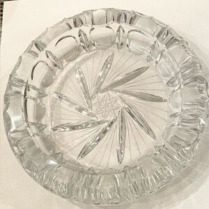 Beautiful, clear, heavy crystal ashtray with star and swirl design.